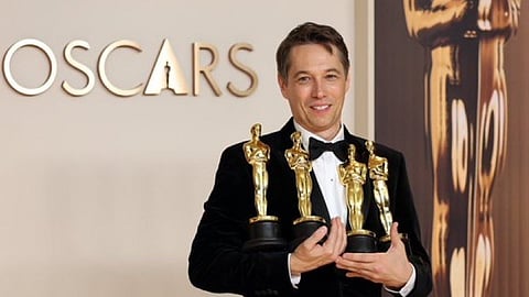 Sean Baker accepts the award for best film editing for “Anora” during the Oscars