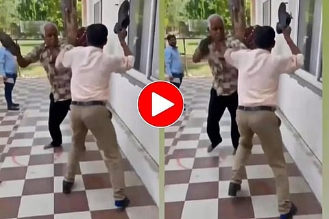 ভাইৰেল ভিডিঅ: নিৰ্দয়ভাৱে যুঁজি থকাৰ সময়ত পুৰুষে ইজনে সিজনক চপ্পলেৰে প্ৰহাৰ কৰে