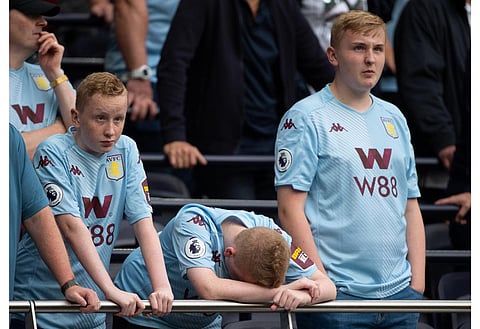 Aston Villa fans watching their team play