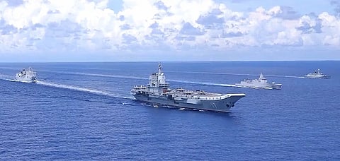 The People's Liberation Army Navy aircraft carrier Shandong with escorting ships underway in the South China Sea in the early autumn of 2022