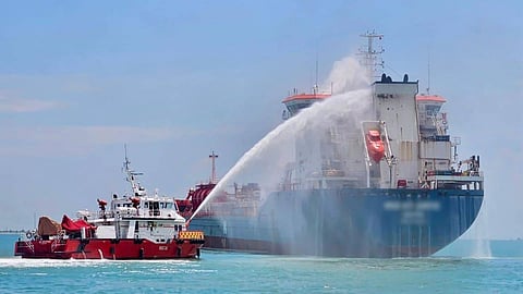 A Singapore Civil Defence Force vessel attempts to extinguish the fire on the Malta-flagged oil tanker Med Atlantic in East Johor Strait, October 21, 2024.