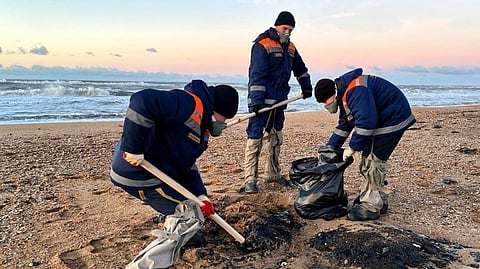 Volunteers helping to clean up Russia's Black Sea coastline following oil spill