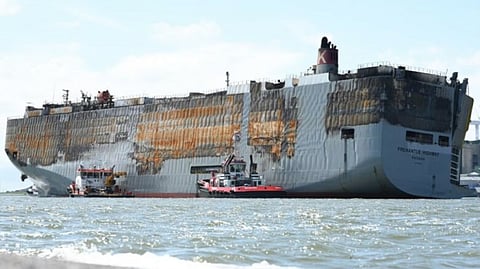The charred hull of the car carrier Fremantle Highway in early August 2023, weeks after the ship suffered a disastrous onboard fire off the Dutch coast