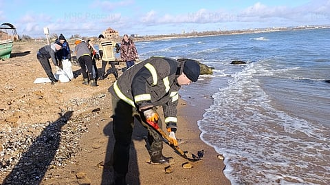Volunteers helping to clean up Russia's Black Sea coastline following oil spill