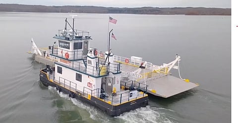 The Summitt tows vehicle-carrying barge The Volunteer across the Tennessee River