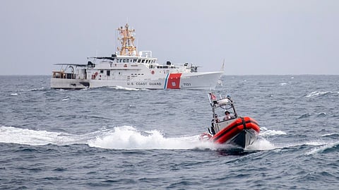 The U.S. Coast Guard conducts operations with the USS Spruance