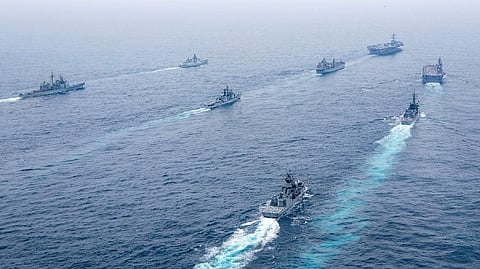 Naval vessels from Australia, India, Japan and United States sail in formation in the Indian Ocean during Exercise MALABAR, October 12, 2021