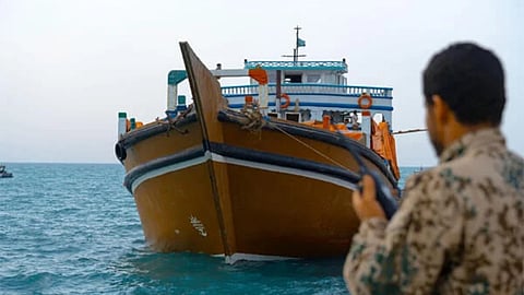 An NRF member observing the seized boat