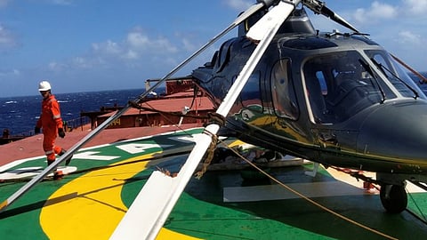 The A109E helicopter tied down on the helideck of the bulk carrier Star Coral