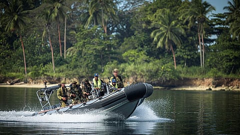 Australian Army soldiers and Papua New Guinea Defence Force soldiers are brought ashore by Papua New Guinea Defence Force coxswains during Exercise Talisman Sabre 2025 in Papua New Guinea.