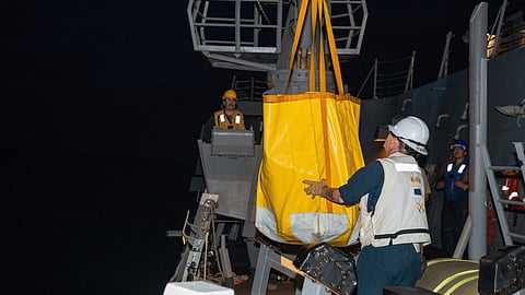 Sailors aboard the Arleigh Burke-class destroyer USS Sampson transfer interdicted contraband onto the boat deck while conducting maritime interdiction operations in the Eastern Pacific Ocean, August 11, 2025.
