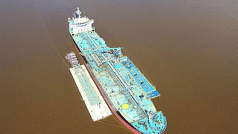 Anchored barge to ship trans-shipment in Amazonas