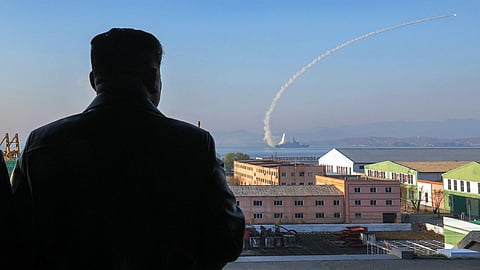 North Korean Supreme Leader Kim Jong-un watches as a Korean People's Army Navy Choe Hyon-class destroyer fires a missile during tests (photo date unknown).