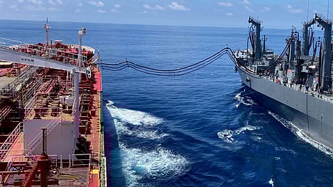 A US Military Sealift Command (MSC) commercial charter tanker, the Stena Imperative, and a Japan Maritime Self-Defence Force (JMSDF) oiler, the JS Ōmi, conducting a consolidated cargo replenishment-at-sea