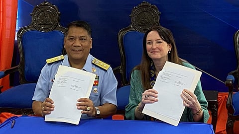 Rear Admiral Rommel Supangan, Philippine Coast Guard Fleet Commander, and Kate Riche, Bureau of International Narcotics and Law Enforcement Affairs Director at the US Embassy in the Philippines, following the signing of the donation agreement, August 18, 2025