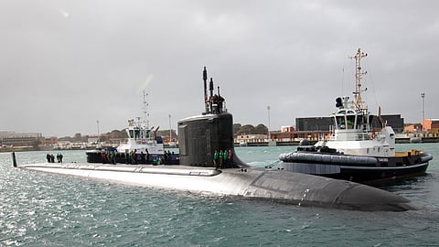 Sailors assigned to the Virginia-class fast-attack submarine USS Hawaii prepare to moor at HMAS Stirling, Western Australia, as part of a scheduled port visit before conducting a submarine tendered maintenance period with the submarine tender USS Emory S. Land, August 22, 2025.