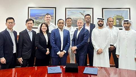 Representatives of Amigo LNG and Drydocks World following the contract signing