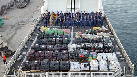Bales containing seized narcotics sit on the aft flight deck of the US Coast Guard Legend-class cutter USCGC Hamilton, August 25, 2025.