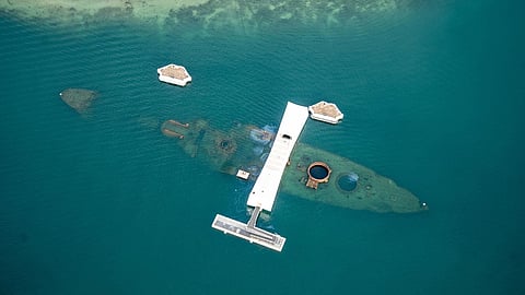 Aerial view of the USS Arizona Memorial at Ford Island, Joint Base Pearl Harbor-Hickam, Hawaii, October 11, 2023. The outline of the battleship's hull can be clearly seen here.