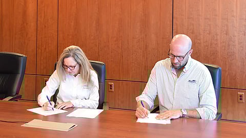 Austal USA President Michelle Kruger and Master Boat Builders President Garrett Rice at the MOU signing at Austal USA's offices in Mobile, Alabama, September 4, 2025