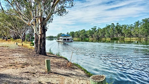 A houseboat leaving lock six on the Murray River near Morgan, South Australia