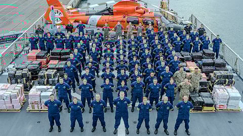Crewmembers of the US Coast Guard national security cutter USCGC Midgett stand at parade rest on the flight deck of the cutter in San Diego, September 25, 2025. Midgett's crew prepared to offload drugs interdicted in the Eastern Pacific during counter-narcotic patrols, eliminating 21,126 pounds of cocaine worth an estimated US$156 million in value.