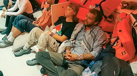 Controversial campaigner Greta Thunberg is pictured with other activists after being detained again by Israeli authorities