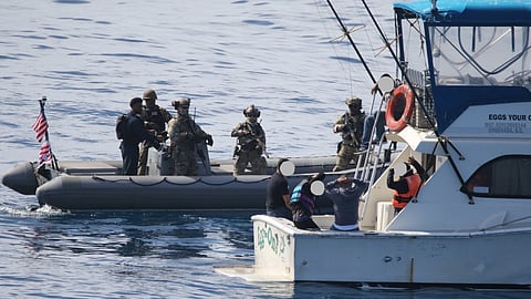 A US Coast Guard law enforcement detachment embarked aboard the US Navy Arleigh Burke-class guided-missile destroyer USS Sampson interdicts 14 aliens aboard a 33-foot sport fishing vessel approximately 18 miles southeast of Catalina Island, California, October 5, 2025.