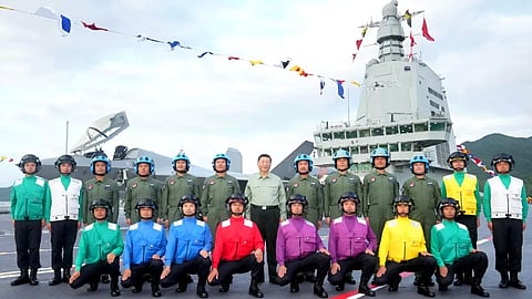 Chinese President Xi Jinping with flight crews and flight deck crews on the People's Liberation Army Navy aircraft carrier Fujian at her commissioning ceremony, November 5, 2025