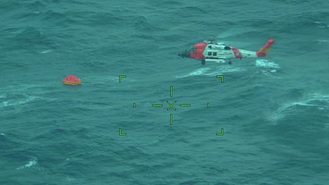 A US Coast Guard MH-60 Jayhawk helicopter crew from Air Station Elizabeth City rescued five individuals from a life raft after their sailboat, Magic Bus, began taking on water 260 nautical miles offshore Cape Hatteras