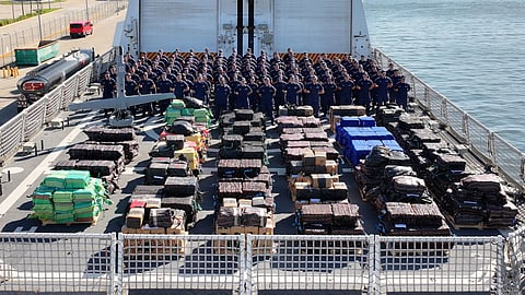 The crew of the US Coast Guard national security cutter USCGC Stone pose for a group photo on the flight deck of the ship in Port Everglades, Florida, November 18, 2025. Stone’s crew offloaded approximately 49,010 pounds of illicit narcotics worth more than US$362 million.
