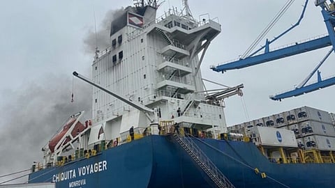 Smoke billows from the superstructure of the container vessel Chiquita Voyager after a fire ignited in its engine room while at the Port of Wilmington in Delaware, November 26, 2025.