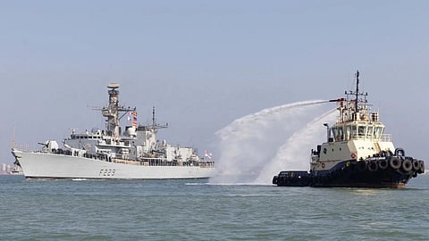 HMS Lancaster receiving a water cannon salute