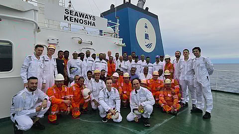 The crews of the tanker Seaways Kenosha and the fishing vssel La Pena pose for a photo on Seaways Kenosha somewhere in the Eastern Pacific Ocean, February 1, 2026. The crew of Seaways Kenosha rescued the crew of La Pena after the latter vessel caught fire and the crew was forced to abandon ship.