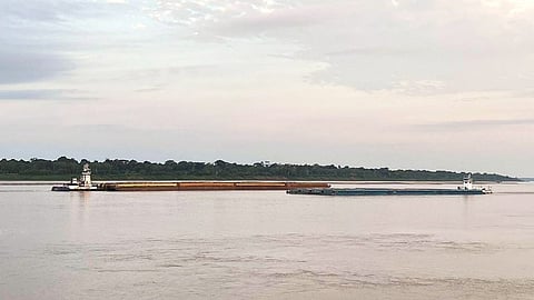 Inland cargo vessels traversing the Madeira River, Brazil