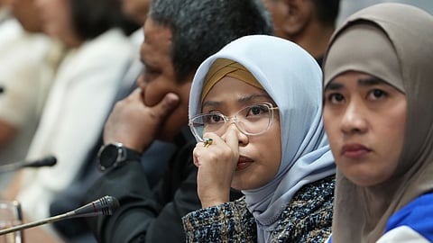 Fatima Sweenee Sajili (in glasses) attends a Philippine Senate consultation regarding the sinking of Aleson Shipping Lines' ferry Trisha Kerstin 3, February 12, 2026. Sajili is one of the 293 people who survived the sinking of Trisha Kerstin 3 off Basilan province in the southern Philippines on January 26, 2026. The same incident left 53 people dead while 25 others are still missing.