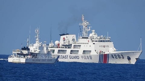 A China Coast Guard patrol ship blocks the passage of the Philippine Coast Guard multi-role response vessel BRP Malabrigo while the latter is escorting a resupply effort to forward-deployed Philippine troops on the disputed Spratly Islands, June 30, 2023.