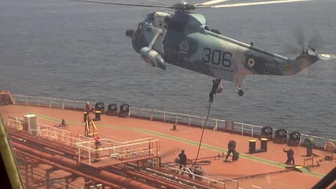 Islamic Republic of Iran Navy commandos fast-rope from a Sea King helicopter onto the Marshall Islands-flagged oil tanker Advantage Sweet in the Gulf of Oman, April 28, 2023. The ship was headed for the United States at the time of its seizure by Iran.