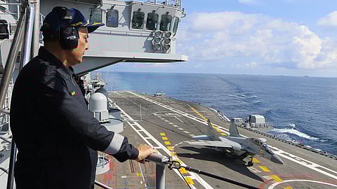 Indian Minister of Defence Shri Rajnath Singh watches from the island superstructure of the Indian Navy aircraft carrier INS Vikramaditya as a MiG-29K fighter aircraft makes an arrested landing on the carrier's flight deck, September 29, 2019.