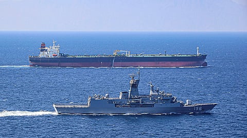 The Royal Australian Navy Anzac-class frigate HMAS Toowoomba escorts a merchant vessel as directed by the International Maritime Security Construct while the ship is deployed to the Middle East, February 14, 2020.