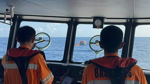 Crew aboard a vessel operated by Indonesian search and rescue agency Basarnas approach a raft carrying all 21 passengers and crew of the boat Nuzila 05, which sank off North Maluku province on March 29, 2026. The survivors were found two days later after they had drifted more than 40 kilometres from where their boat sank.