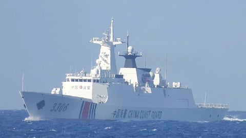 Photograph of a China Coast Guard ship shadowing the Philippine Coast Guard multi-role response vessel BRP Malapascua while the latter is en route to Thitu Island in the Spratlys, May 27, 2025