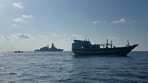 The Iranian-flagged dhow Alwaseemi with an EUNAVFOR Atalanta warship in the distance
