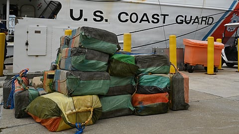 Bales of illicit drugs worth more than US$19 million are stacked on a pier during a drug offload from the US Coast Guard medium endurance cutter USCGC Resolute at Base Miami Beach, Florida, April 23, 2026. The seized contraband was the result of three interdictions in the Caribbean Sea.