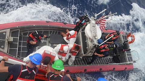 The crew of the US Coast Guard fast response cutter USCGC Heriberto Hernandez disembark a group of people to the cutter's small boat before being transferred to a Dominican Republic Navy vessel, June 7, 2026, during the repatriation of 32 aliens who were interdicted by the cutter a day earlier off Desecheo, Puerto Rico.