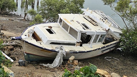 The wrecked fishing vessel Amastra prior to its removal from the Pioneer River in Mackay