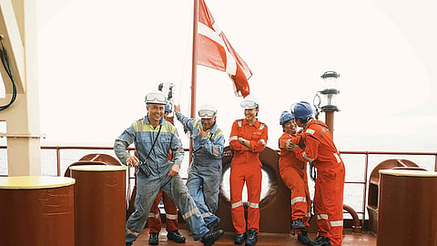 A group of deck cadets having a lighthearted moment on the product tanker Maersk Curacao
