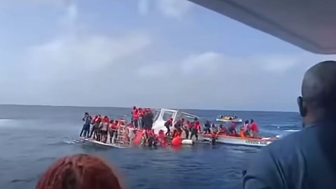Rescuers help evacuate passengers and crew from the partially submerged ferry Apple Syder off Basseterre, Saint Kitts and Nevis, June 29, 2026.