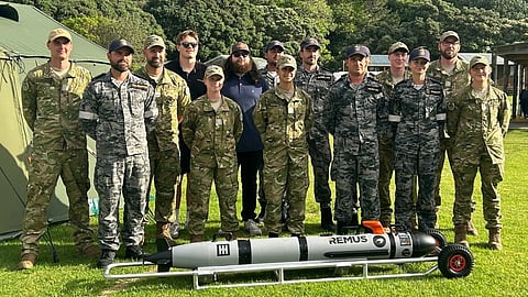 New Zealand Defence Force and Australian Defence Force personnel with an unmanned underwater vehicle at the remote training area of Tauranga Bay in Northern New Zealand as part of Exercise Nautilus