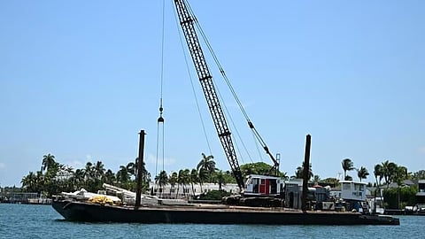 The tug and barge involved in a collision with a sailboat that left three people dead in Biscayne Bay off Florida on July 28, 2025